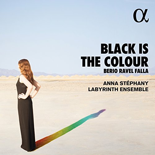 CD cover: woman in black dress, desert landscape, rainbow light.