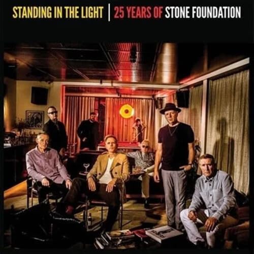 Stone Foundation band members in a dimly lit room, vinyl record cover.
