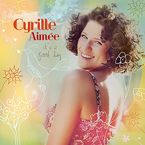 CD cover featuring Cyrille Aimée, smiling, with floral and bird illustrations.