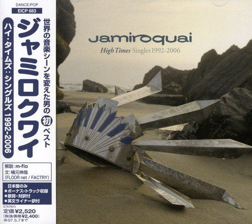 Jamiroquai “Greatest Hits” CD cover with a metallic bird sculpture on a beach.