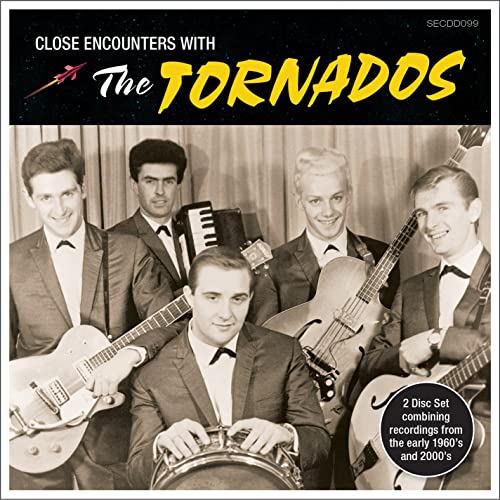 Black and white photo of 1960s band The Tornados with instruments.
