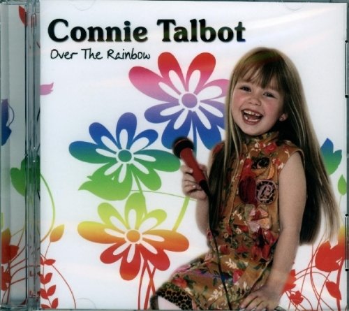 CD cover featuring a young girl with a microphone and colorful flowers.