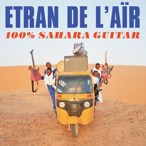 Album cover: musicians with guitars and a yellow vehicle in desert.