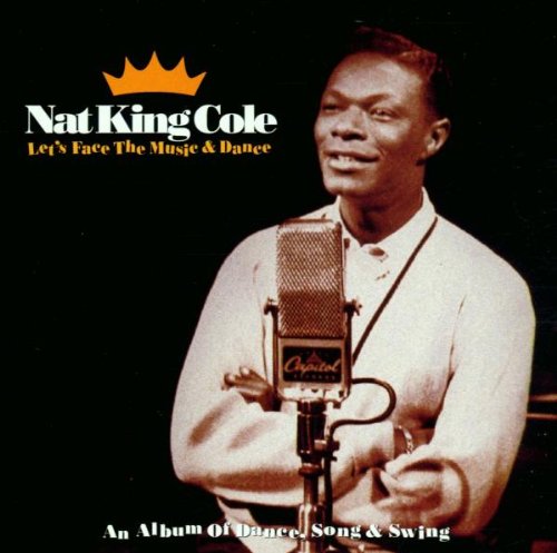 Nat King Cole smiling at a microphone on a CD album cover.