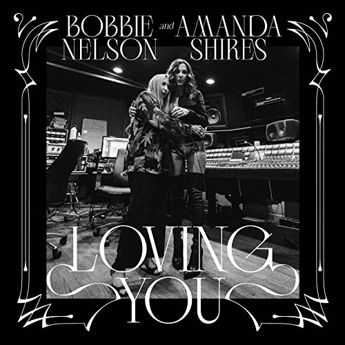 Black and white photo of Bobbie Nelson and Amanda Shires embracing.