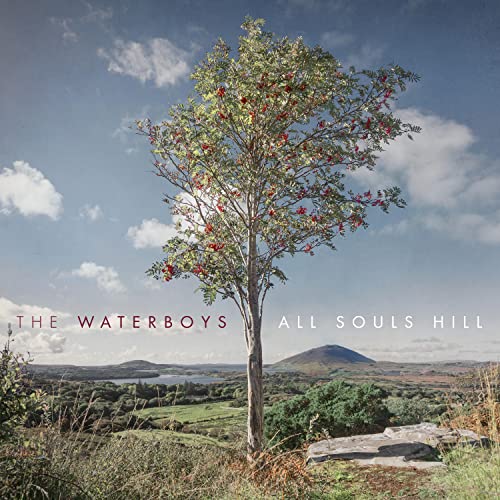 CD cover: tree with red berries, hill, and cloudy sky landscape.