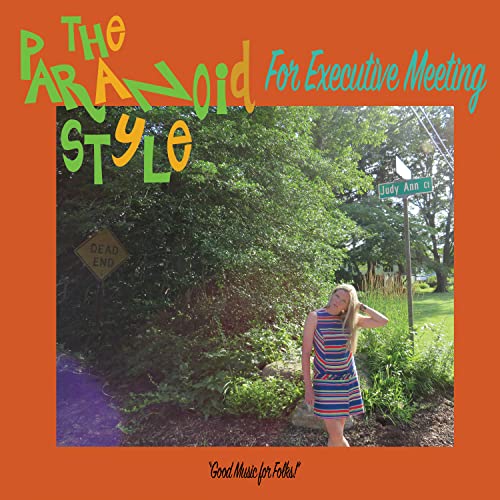 Album cover: "The Paranoid Style" with a woman standing by trees.