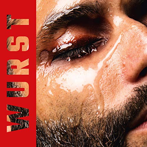 Close-up of Conchita Wurst’s face with water droplets and red text.