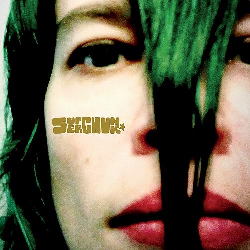 CloseClose-up of a face partially obscured by green streaks with "Superchunk" text.