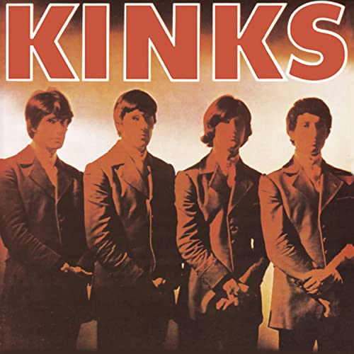 The Kinks debut album cover featuring the four band members in dark suits.