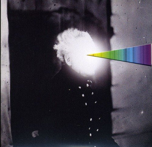 CD cover with abstract white and rainbow light against a dark background.