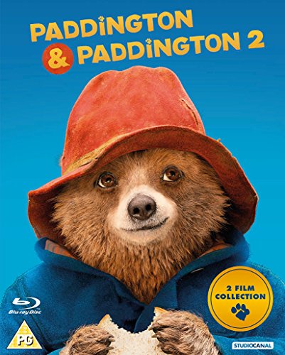 Paddington Bear wearing a red hat, holding a sandwich, on a blue background.