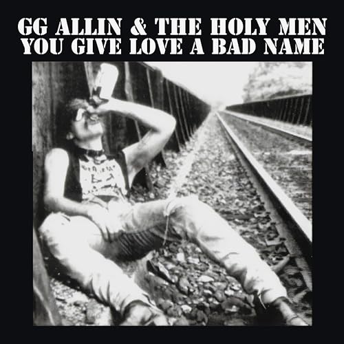 GG Allin album cover: man on railroad tracks drinking alcohol.