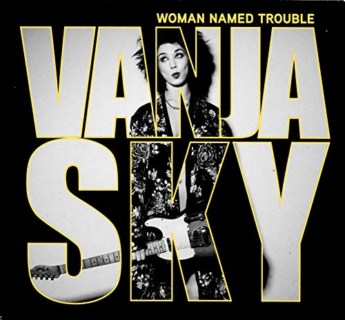 Vanja Sky album cover: woman with guitar, bold yellow text on black.