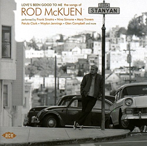CD cover featuring a man leaning on a car in a street scene.