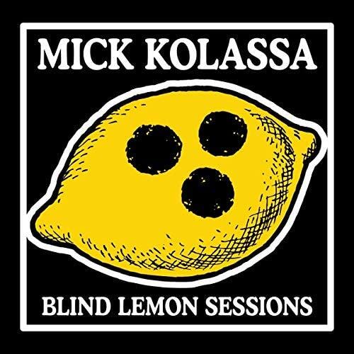 Black and white album cover with a yellow lemon and text.