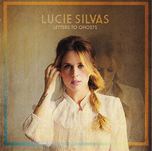 CD cover: Lucie Silvas portrait with faded ghostly image background.