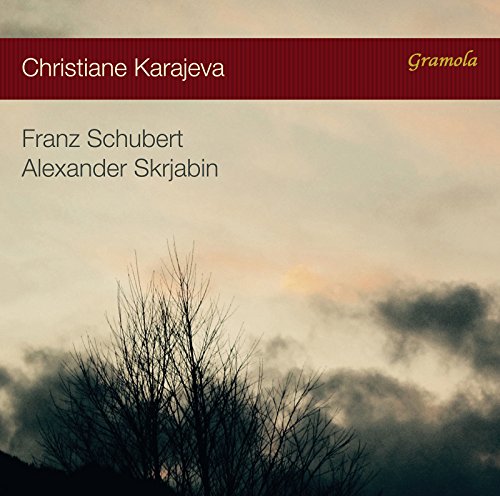 CD cover with artist name, composers, and a winter tree silhouette.