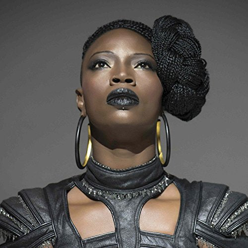Close-up portrait of Dobet Gnahore, a Black woman with braided hair.