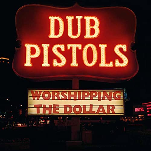 Red neon sign reading "Dub Pistols - Worshipping The Dollar" at night.