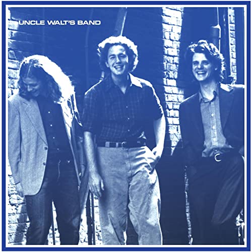 Vintage album cover featuring three men in front of a brick wall.