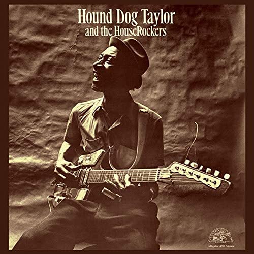 Hound Dog Taylor plays guitar, album cover with textured background.
