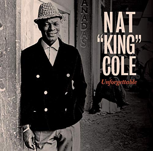 Nat King Cole in a hat and jacket, album cover for "Unforgettable".