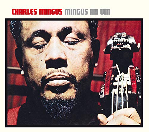 Album cover featuring a close-up of Charles Mingus next to a small statue.