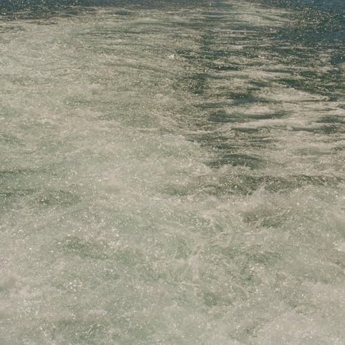 Foamy ocean water with a blurred, textured surface.