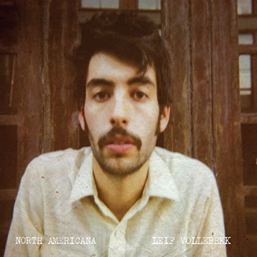 Vinyl record cover featuring a portrait of a man with a mustache.