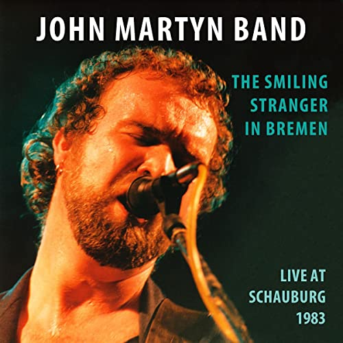 John Martyn singing into a microphone, album cover for "The Smiling Stranger".