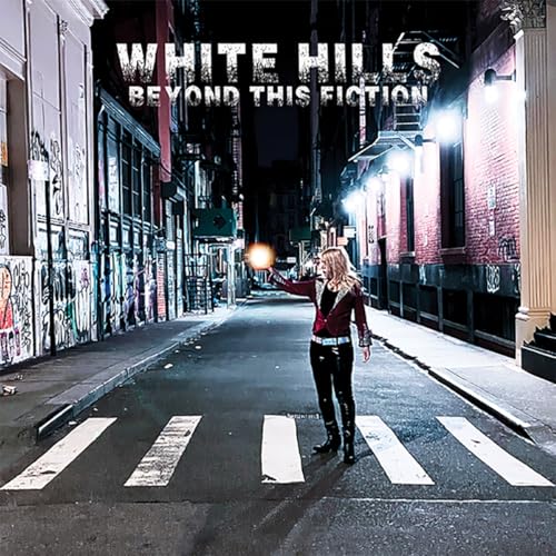 Album cover: street scene with a woman crossing a zebra crossing.