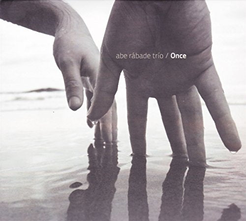 CD cover: two hands reaching towards water, black and white.