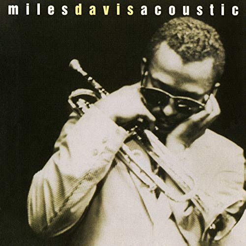 Miles Davis playing trumpet, close-up portrait on album cover.