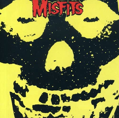 A yellow and black graphic of a skull with the word Misfits in red.