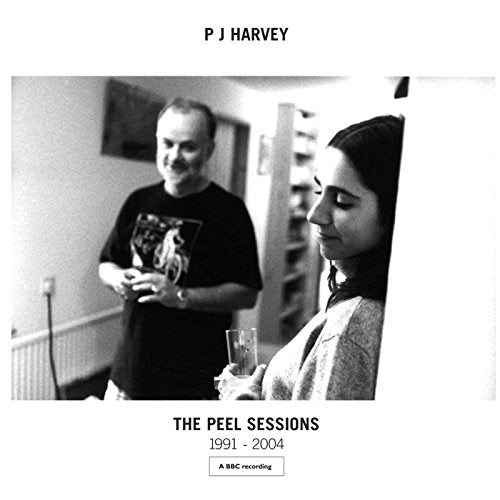 PJ Harvey album cover: black and white photo of two people, text details.