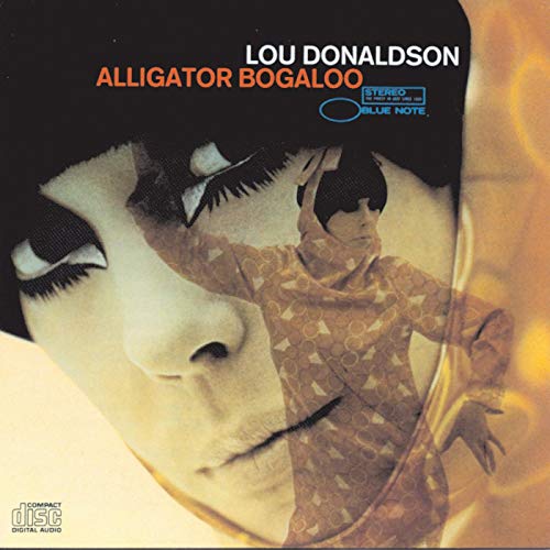 Album cover for Lou Donaldson’s “Alligator Bogaloo” featuring a stylized face.