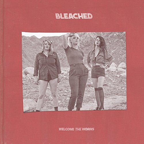Bleached album cover: three women in desert landscape, black and white.