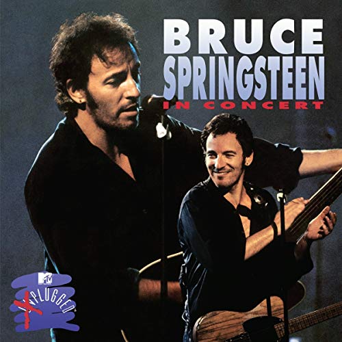 Bruce Springsteen performing on stage with an acoustic guitar, MTV Unplugged logo in corner.