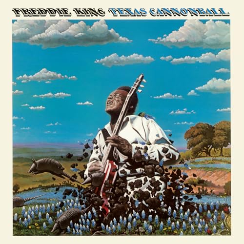 Album cover: Freddie King with guitar, armadillos, and bluebonnets.
