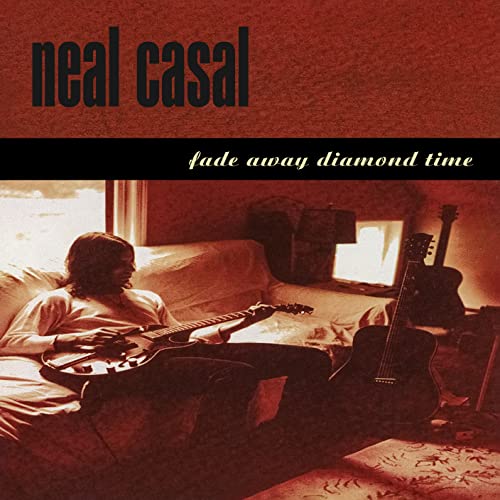 Neal Casal album cover: man playing guitar on a couch.