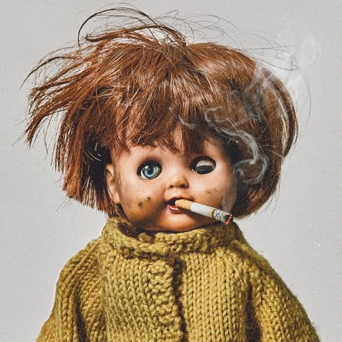 Doll with blue eyes smoking a cigarette, textured sweater visible.