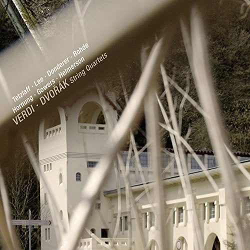 CD cover with a blurred image of a white building and tall grass.