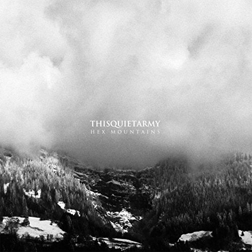 Black and white album cover with snowy mountains obscured by clouds.