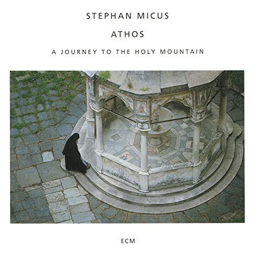 CD cover: a monk near an ornate stone structure on a path.