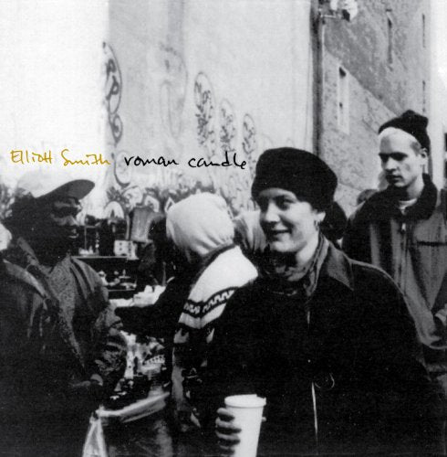 Black and white album cover featuring Elliott Smith and three people.