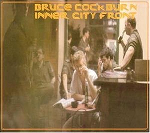 Bruce Cockburn’s “Inner City Front” CD cover with a street scene.