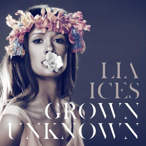 Woman with floral crown and white flower, album cover for Ices’ “Grown Unknown”.