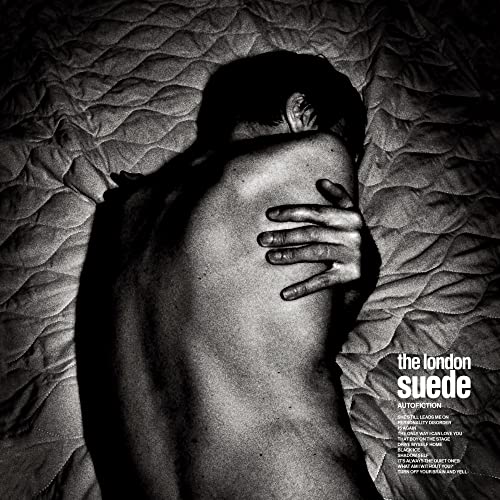 Black and white album cover featuring a person lying face down in fabric.