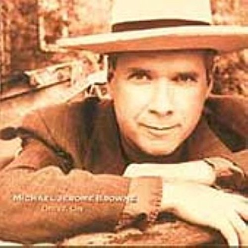 CD cover featuring a man in a hat smiling at the viewer.